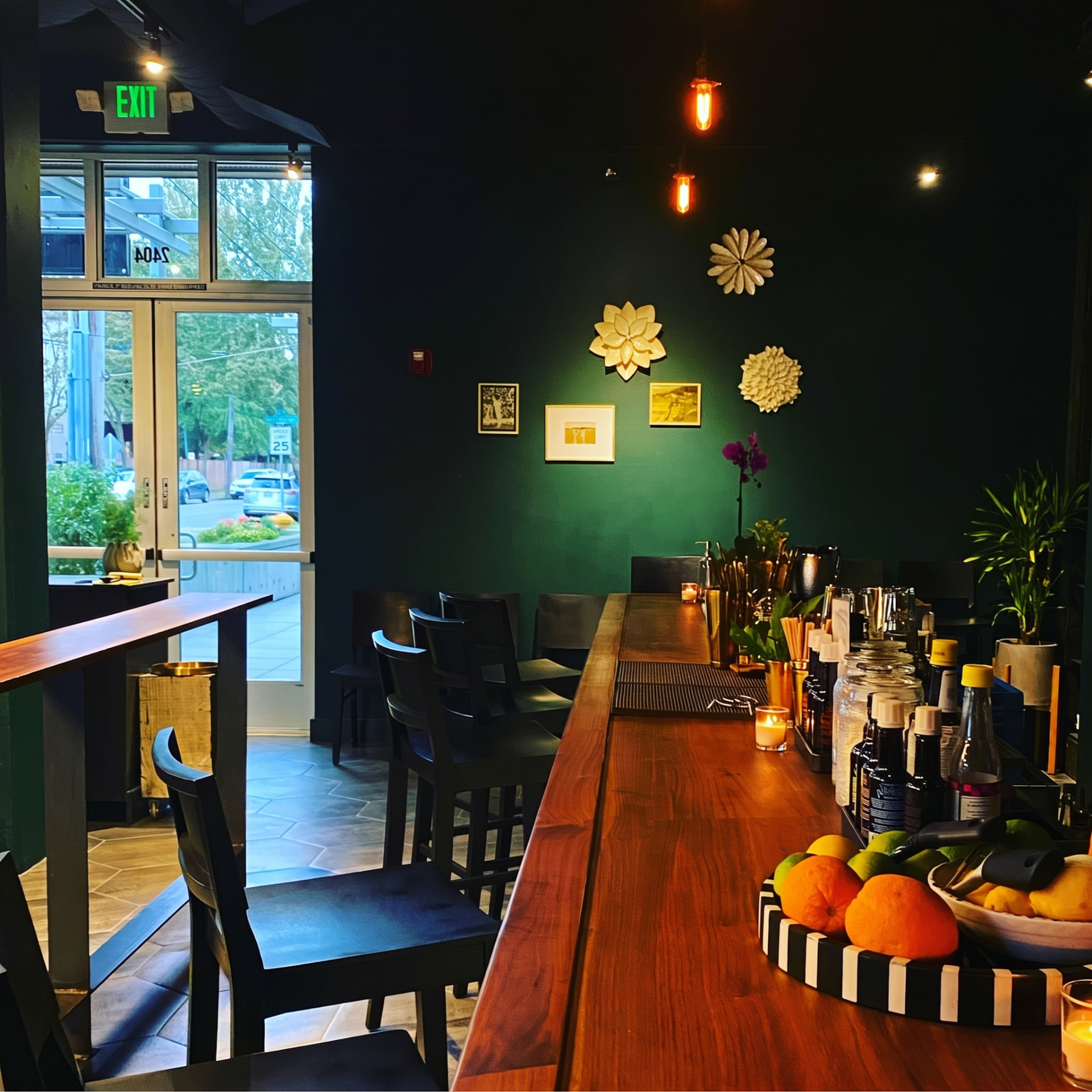 The long bar beneath Edison bulbs
